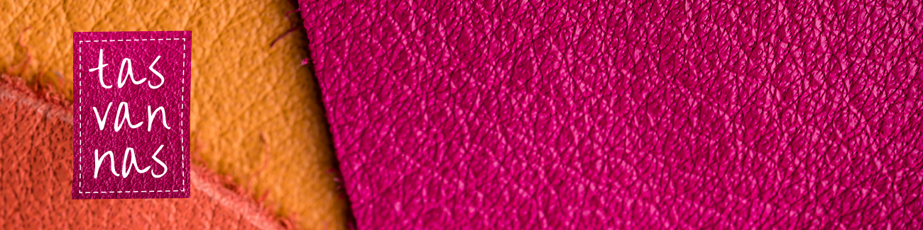 Natural colored leather background closeup.